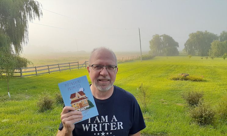 John Van Rys holding Moonshine Promises in the foggy front yard of his rural Ontario hobby farm. Photo by April Van Rys